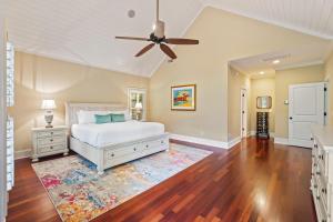 a bedroom with a bed and a ceiling fan at BW3038: 3038 Baywood Drive in Seabrook Island +49 photos