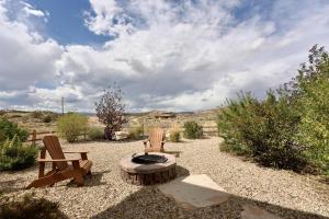 two chairs and a fire pit in a yard at Escalante Escapes Holly Hock- King Escape in Escalante