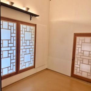 a room with two windows and a door at Andong GyeongHamjeong in Sindang +13 photos