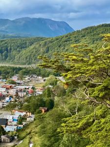 a small town in a valley with mountains in the background at Surí refugios Villa O'Higgins, Fin de la Carretera Austral in Villa O'Higgins