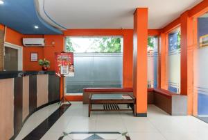a waiting room at a fast food restaurant at RedDoorz Plus @ Jalan Pemuda Jakarta in Jakarta