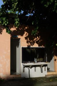 a bench sitting in front of a building at Chang Chang Cozy Home in Kon Rung (1)