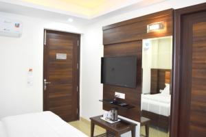 Postel nebo postele na pokoji v ubytování Hotel Tara Palace Redfort