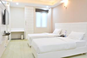 Postel nebo postele na pokoji v ubytování Hotel Tara Palace Redfort
