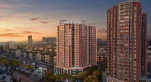 a view of a large building in a city at City Comfort Inn Huangshi Daye Tongluowan Business Street in Huangshi