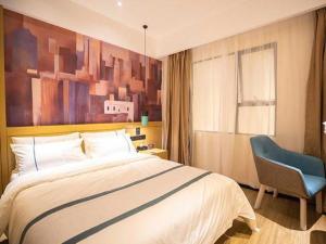 Ένα ή περισσότερα κρεβάτια σε δωμάτιο στο City Comfort Inn Laibin Wuxuan Yuda +55 φωτογραφίες