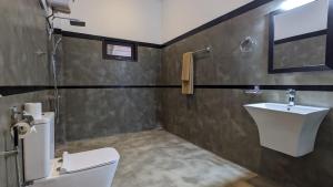 a bathroom with a toilet and a sink at Ima villa in Tangalle +44 photos