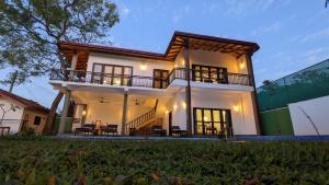 a view of a house at night at Ima villa in Tangalle