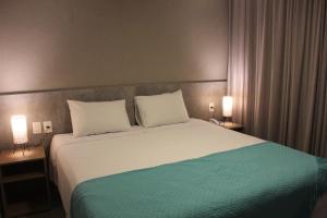 Postel nebo postele na pokoji v ubytování Amenit Hotel