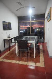 a dining room with a table and chairs and a window at Hotel DaMar Puerto Vallarta in Puerto Vallarta
