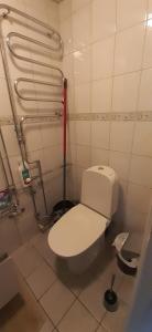 a bathroom with a white toilet in a stall at Wonderful Stay Helsingborg in Helsingborg