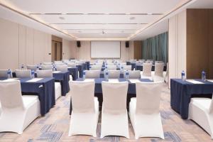 a conference room with blue tables and white chairs at Onejee Hotel Shenzhen in Shenzhen +279 photos