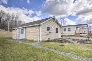 a small white house with a yard at Suite To Unwind Autumn Midweek - 35 Off Promo! in Pleasant Mount