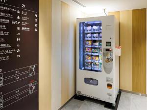 a vending machine with drinks in a room at Hotel Dream Gate Maihama in Chiba