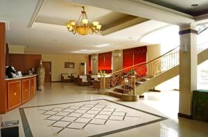 a large lobby with a staircase in a building at Karlita Hotel Tegal in Tegal +166 photos