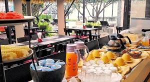 a buffet of food and drinks on a table at Purimuntra Resort And Spa in Pran Buri