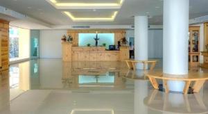 a large room with a altar in a building at Piyaporn Pavilion Hotel in Mae Sai