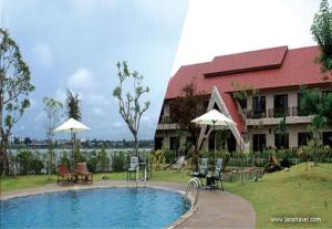 a resort with a swimming pool and a building at Daosavanh Resort & Spa Hotel in Savannakhet