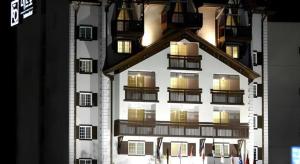 a tall building with lit up windows on it at Metro Tourist Hotel Cheonan in Cheonan