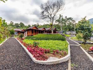 a house with a garden in front of it at Shankara Forest Haven Villa by AGATA in Jatiluwih