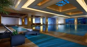a large swimming pool in a hotel room at Dongwu New Century Grand Hotel Huzhou in Huzhou