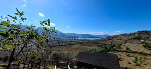 a view of a hill with a lake in the background at Bukit Samudra in Lemonga