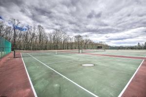 a tennis court with two tennis courts at Quadruple Family Suite Autumn Midweek - 35 Off Promo! in Pleasant Mount