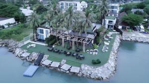 an aerial view of a house on the water at Eco Moment Beach Resort in Phetchaburi