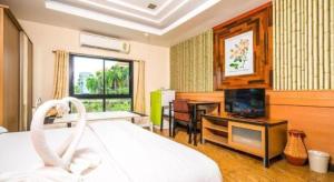 Katil atau katil-katil dalam bilik di Prew Lom Chom Nam Resort