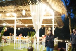 a woman standing in front of a tent with a table at River View Resort At Chaewlan in Ban Pha Saeng Lang +291 photos