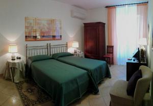 Postel nebo postele na pokoji v ubytování Hotel Umbra