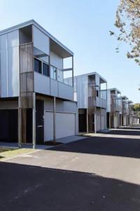 a large white building with a lot of windows at Studio 34 Bayshore Drive in Byron Bay