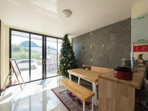 a kitchen with a christmas tree in a room at 5 Diamond in Bangkok