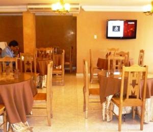 a man sitting at a table in a restaurant at Hotel Montreal in Panama City