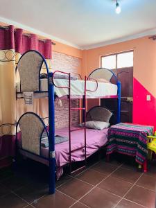 Postel nebo postele na pokoji v ubytování Backpackers Oruro B&B