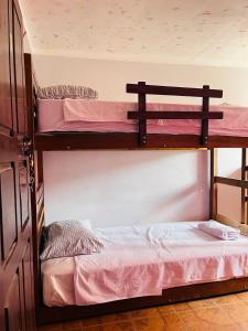 a bedroom with two bunk beds in a room at Backpackers Oruro B&B in Oruro +41 photos