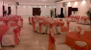 a banquet hall with red and white tables and chairs at Celuisma Playa Dorada All Inclusive in Sampiño +116 photos
