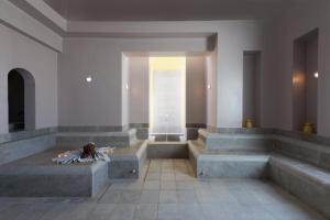 a lobby with concrete steps and a window at Iberostar Selection Diar El Andalous in Port El Kantaoui