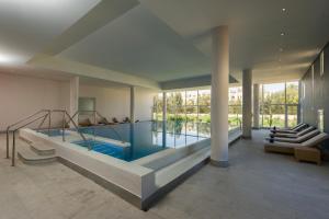 a swimming pool in the middle of a house at Iberostar Selection Diar El Andalous in Port El Kantaoui