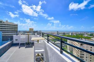 a balcony with a table and chairs on a building at ® {The~City~LUX~Place}@DowtownSD in La Julia
