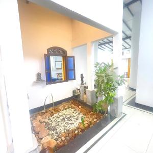 a fish pond in the middle of a room at Villa Senu in Ambalangoda