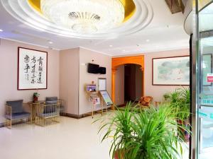 Un televizor și/sau centru de divertisment la GreenTree Inn Wuxi Xinwu District Meicun Town Taibo Avenue