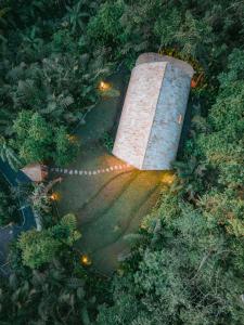 an overhead view of a stone structure with lights at Nirvana Sidemen - The Aesthetic Stay in Sidemen