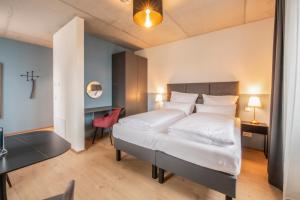 Ένα ή περισσότερα κρεβάτια σε δωμάτιο στο Das Adler +54 φωτογραφίες