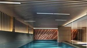 a hallway with a pool in a building at Grand Skylight Hotel KaiMei in Nanchang