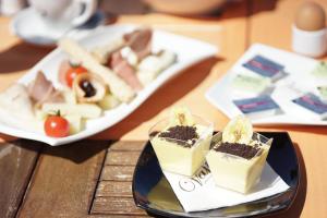 a plate of food on a table with a plate of food at Valis Resort Hotel in Volos
