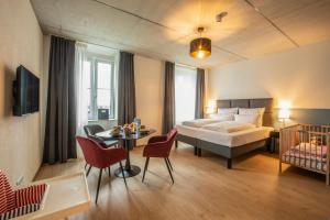 Ένα ή περισσότερα κρεβάτια σε δωμάτιο στο Das Adler