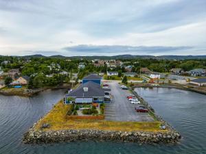an aerial view of a house on an island in the water at Bayview Inn in Bay Roberts