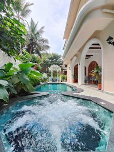a swimming pool in the middle of a house at Villa Laz, Parra close to calangute- Pool,Jacuzzi,Cook in Parra