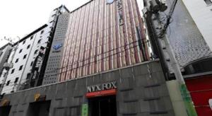 a large building with a my rock sign on it at Hotel Nyxfox in Cheonan